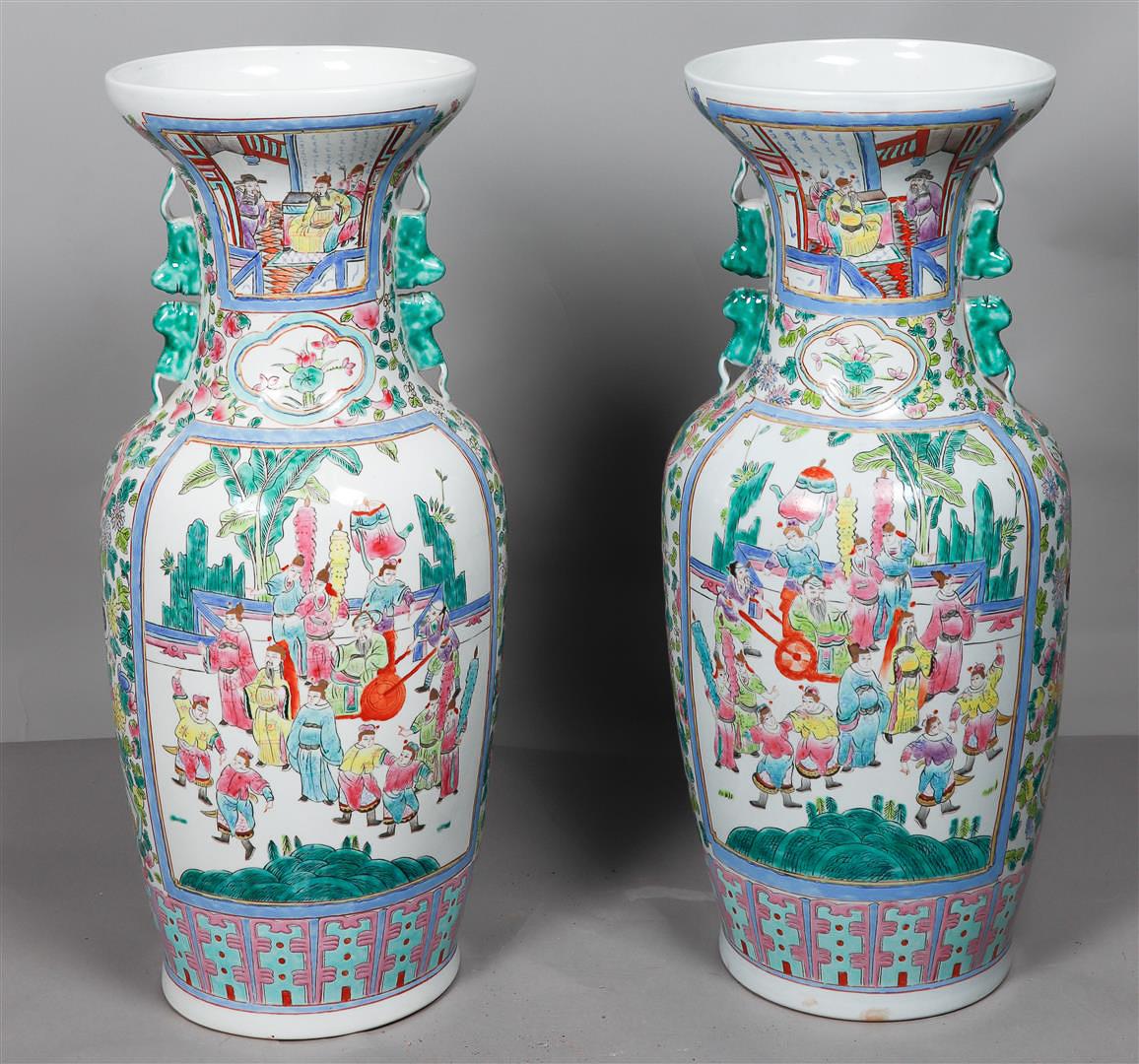A pair of large Famille Rose vases decorated with various figures. Late 20th century.