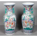A pair of large Famille Rose vases decorated with various figures. Late 20th century.