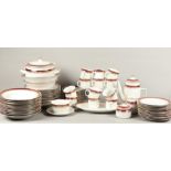 A large porcelain 12 person service consisting of soup plates, dinner plates, breakfast plates, coff