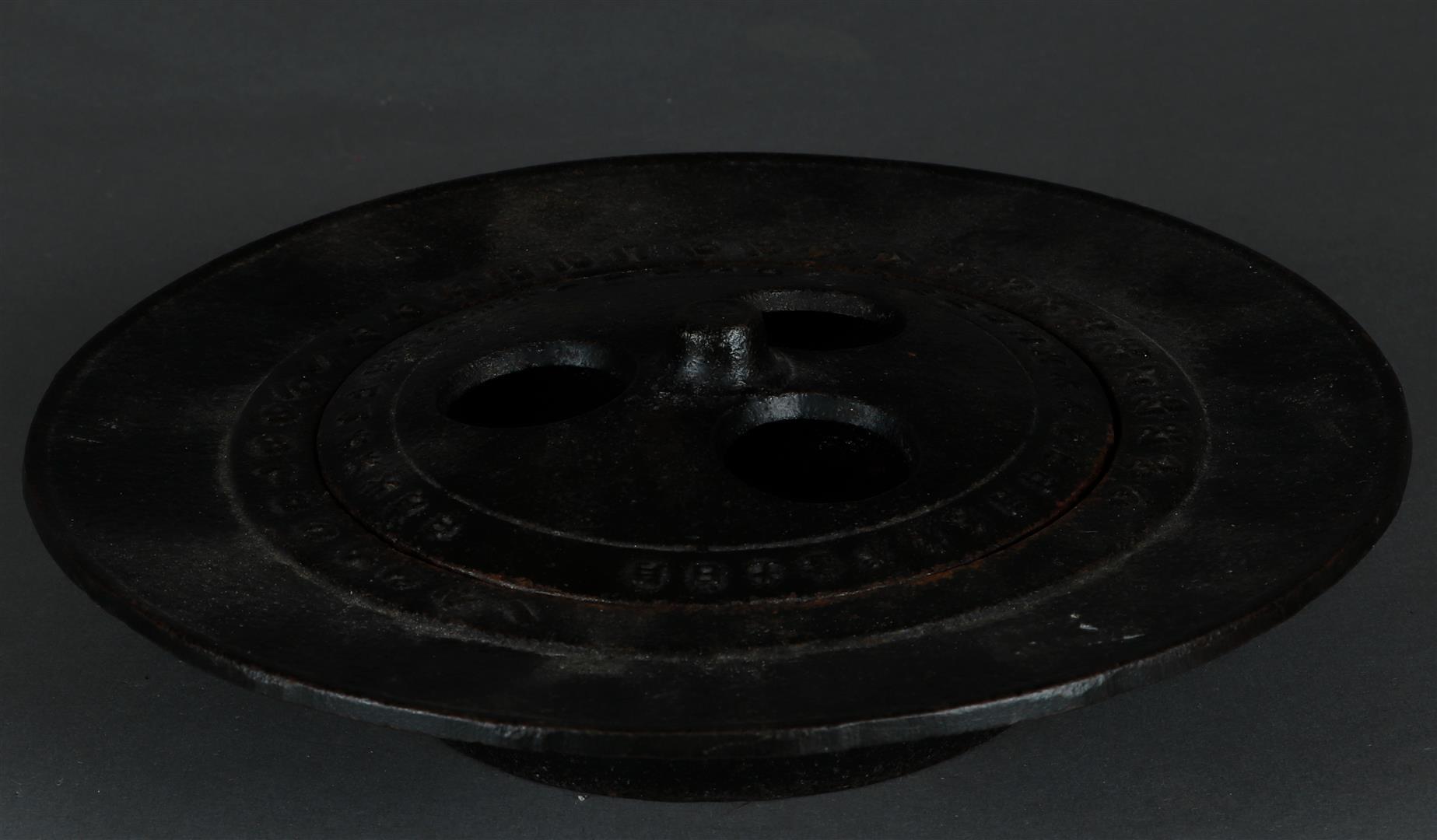 A cast iron incense burner decorated with Arabic and Chinese numerals. China, 20th century.