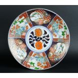 A porcelain Imari dish. Japan, 20th century.