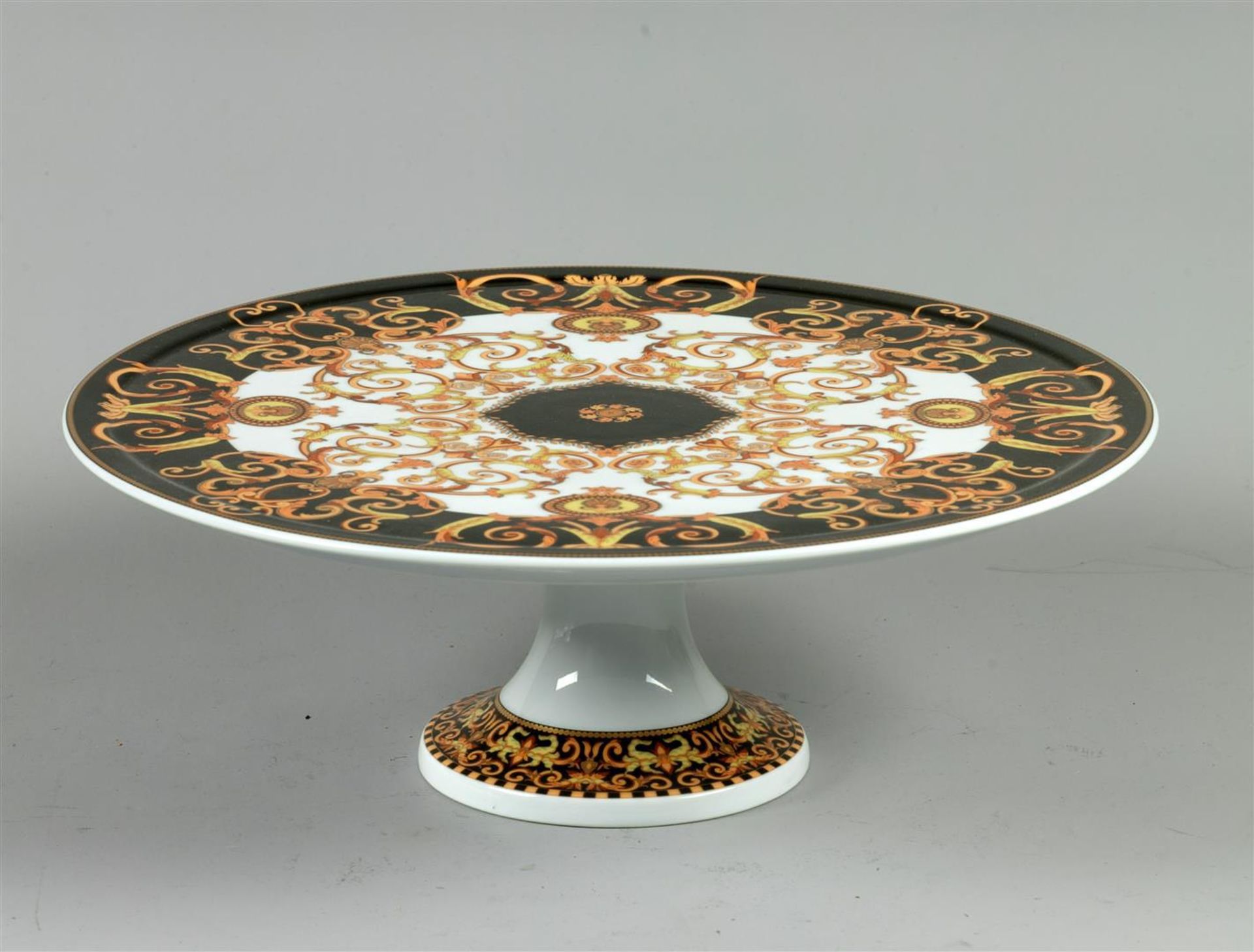 A porcelain cake tray with Baroque decor, Rosenthal for Versace. Germany, late 20th century.