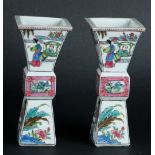 A pair of porcelain Famille Rose vases with figures in garden decor. China, 20th century.