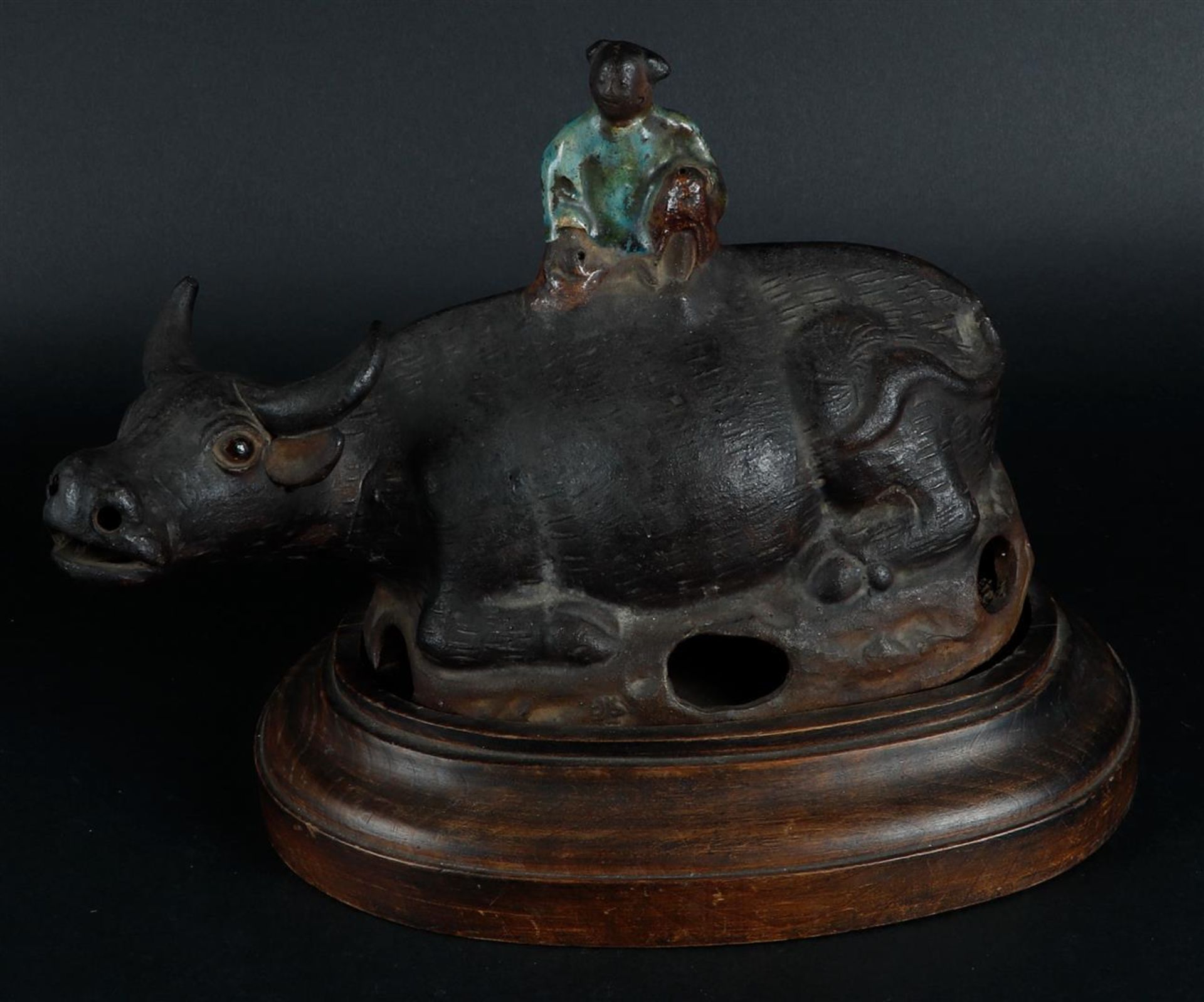 A terracotta incense burner in the shape of an ox with a Chinese boy. China, 19th century.