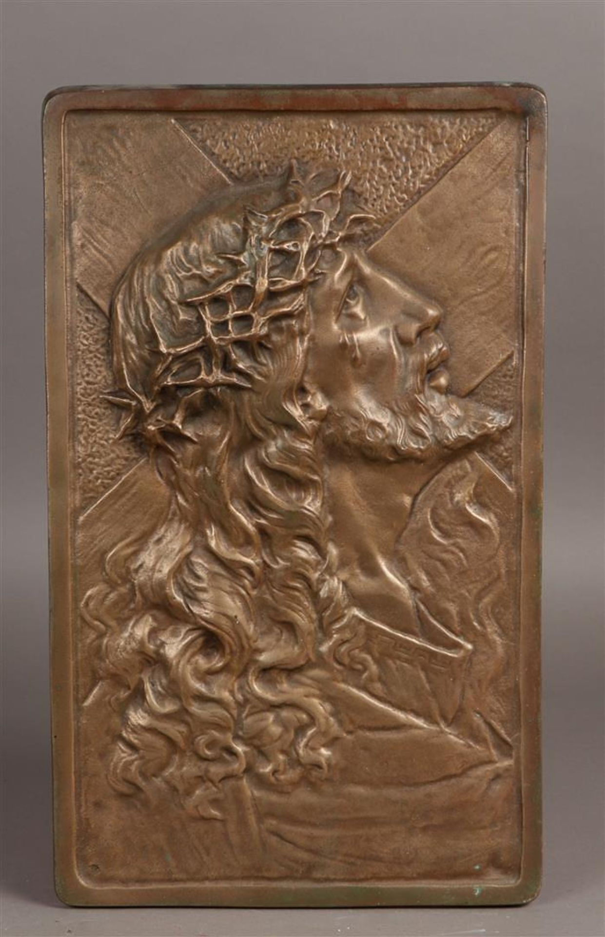 A bronze plaque depicting a weeping Jesus Christ. 20th century.