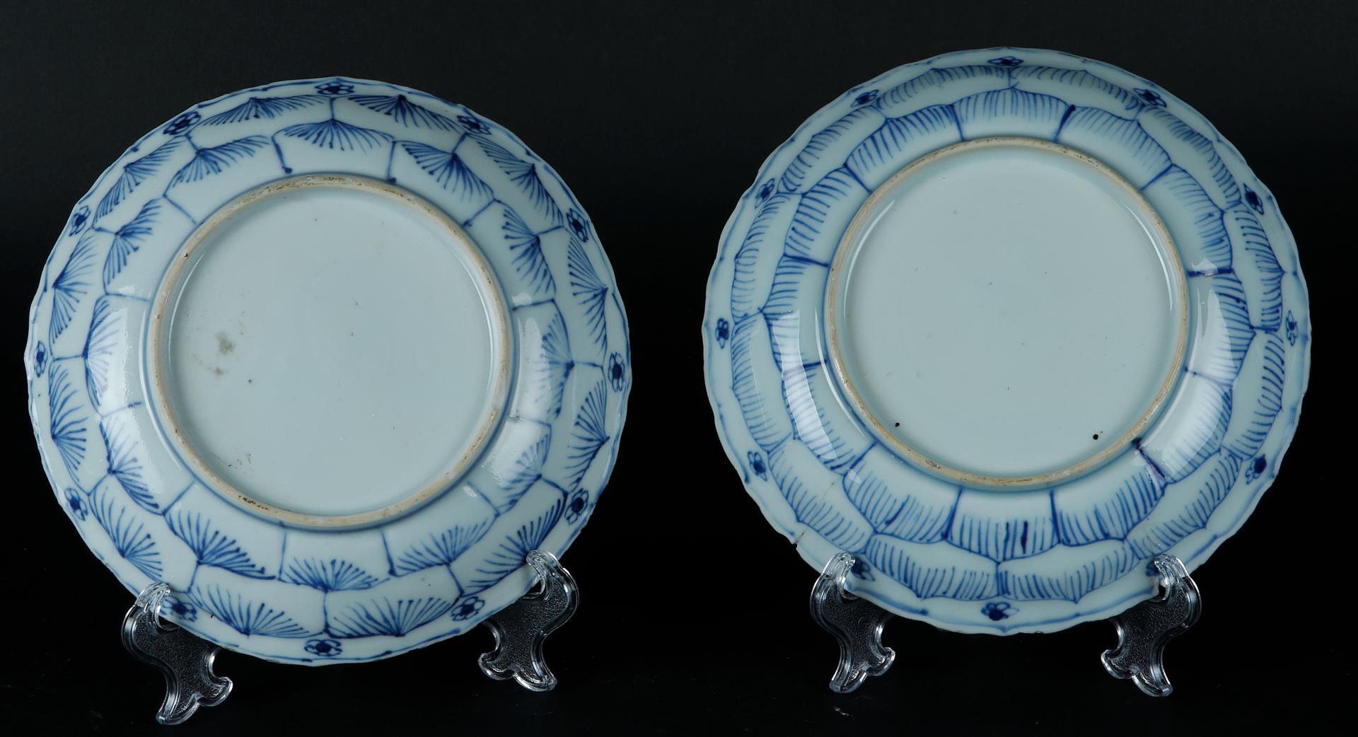 Two porcelain plates with floral outer border decoration, the center with two standing frames with f - Image 2 of 2