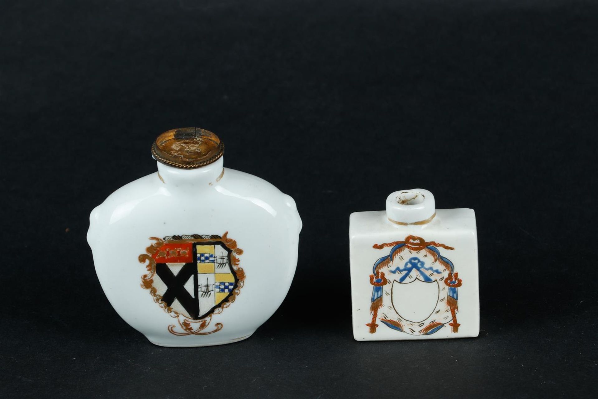 Two porcelain snuff bottles with weapon decoration. European, 19th/20th century.