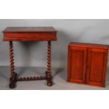 A 19th century game table / sewing table, with a hanging cabinet with mahogany doors.
