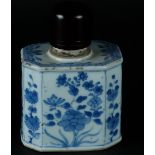 A porcelain angled tea caddy with rich floral decoration on the sides, with wooden lid. China, Yongz