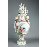A capital porcelain lidded vase with crowned lid and a coat of arms held up by putti. Hand-painted c