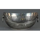 A silver openwork bonbon basket decorated with lion heads. Silver factory Voorschoten. Year letter R