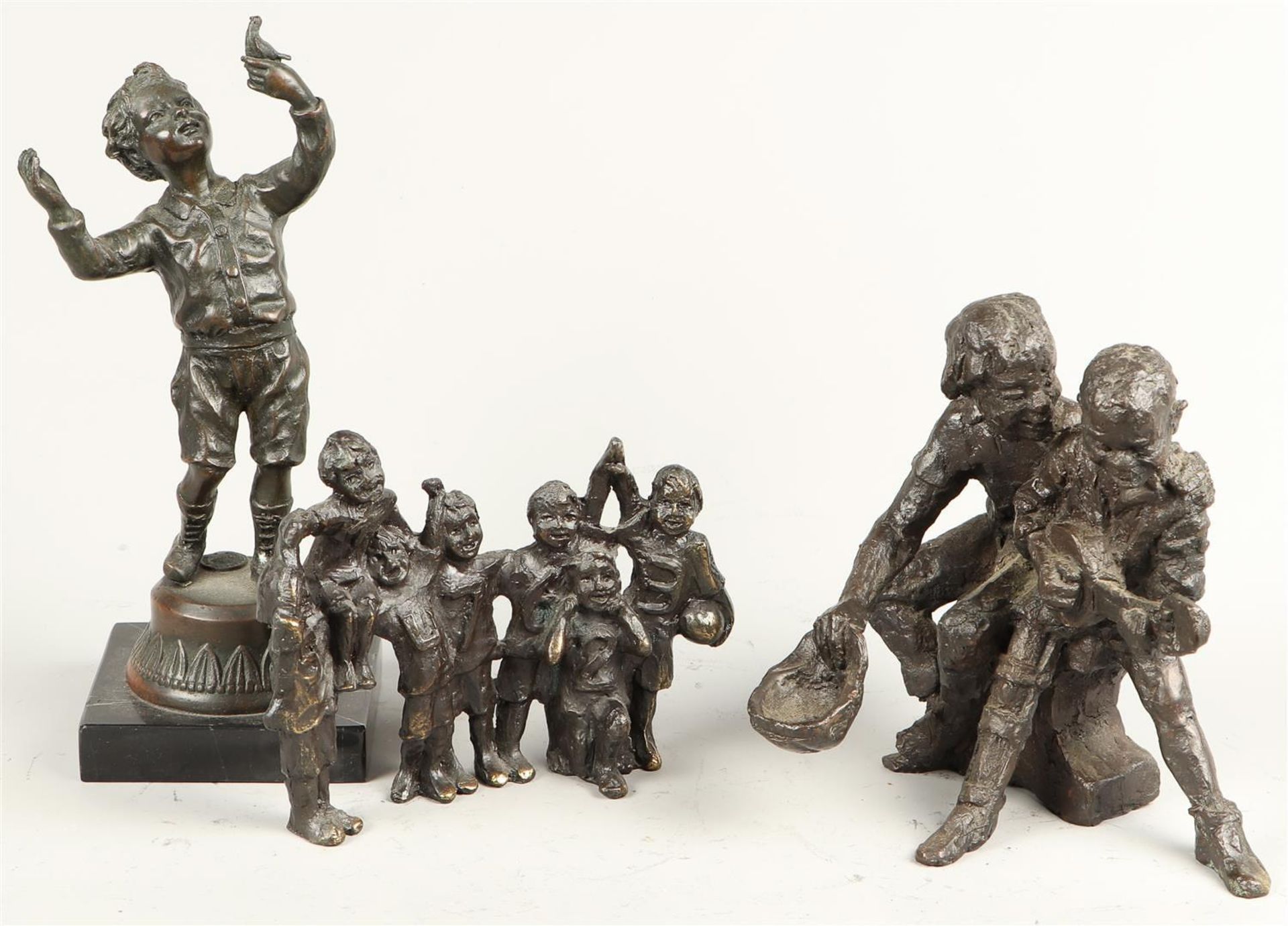 One lot consisted of (3) bronze statues with the theme of children. 2nd half of the 20th century.