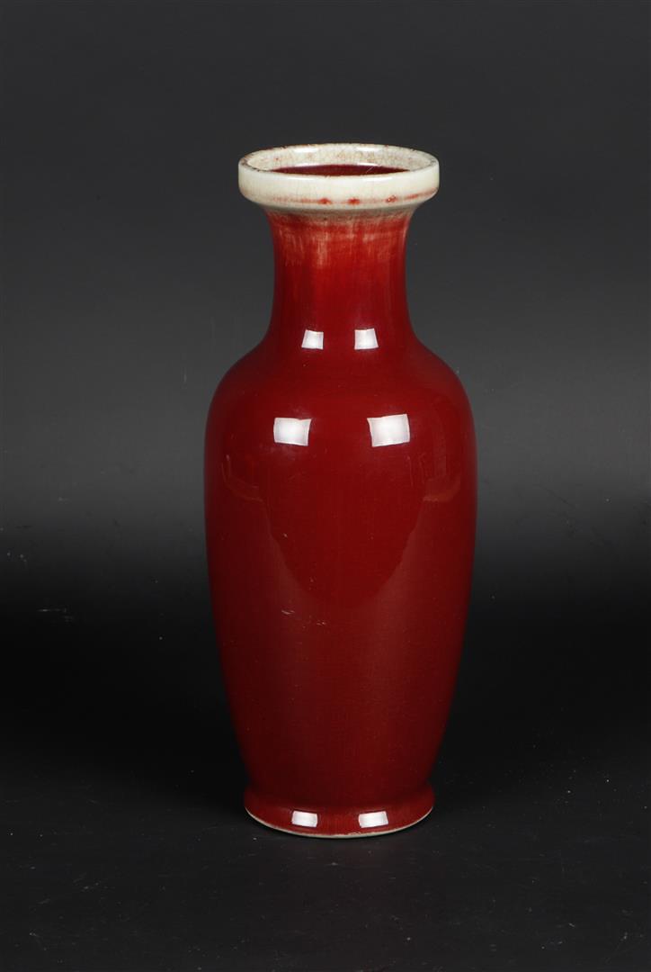 A porcelain Sang de boeuf vase, marked on the bottom. China, 20th century.