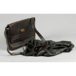 A brown leather Gucci cross body handbag. with accompanying fabric protective bag.