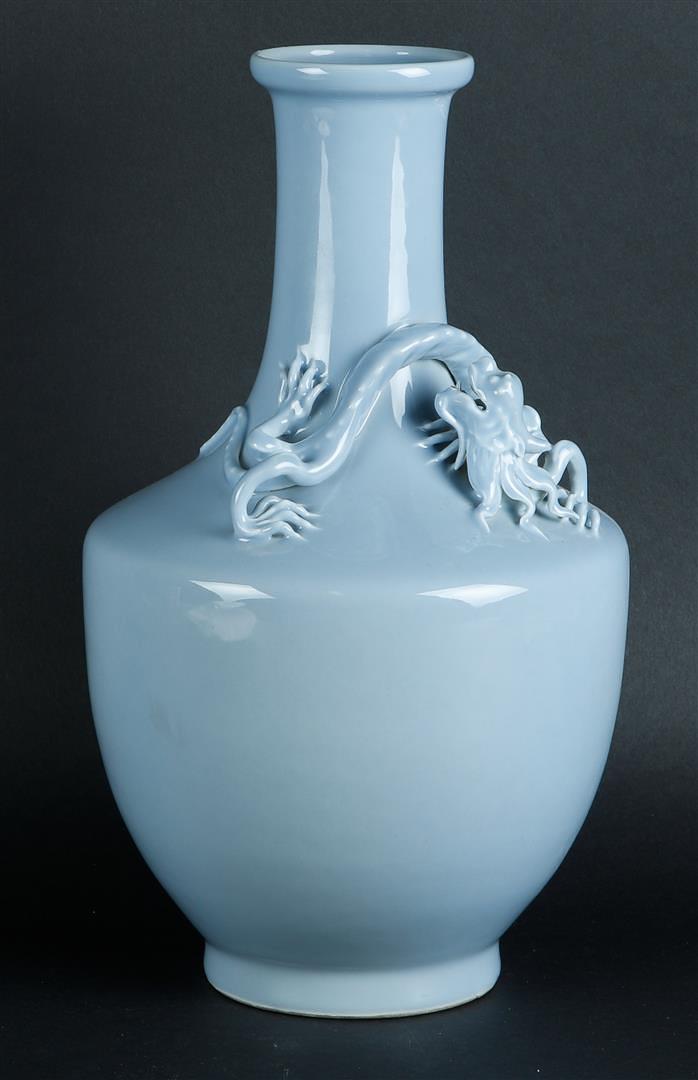 A large porcelain blue monochrome belly vase with an embossed dragon around the neck. With Yongzheng