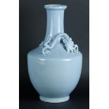 A large porcelain blue monochrome belly vase with an embossed dragon around the neck. With Yongzheng