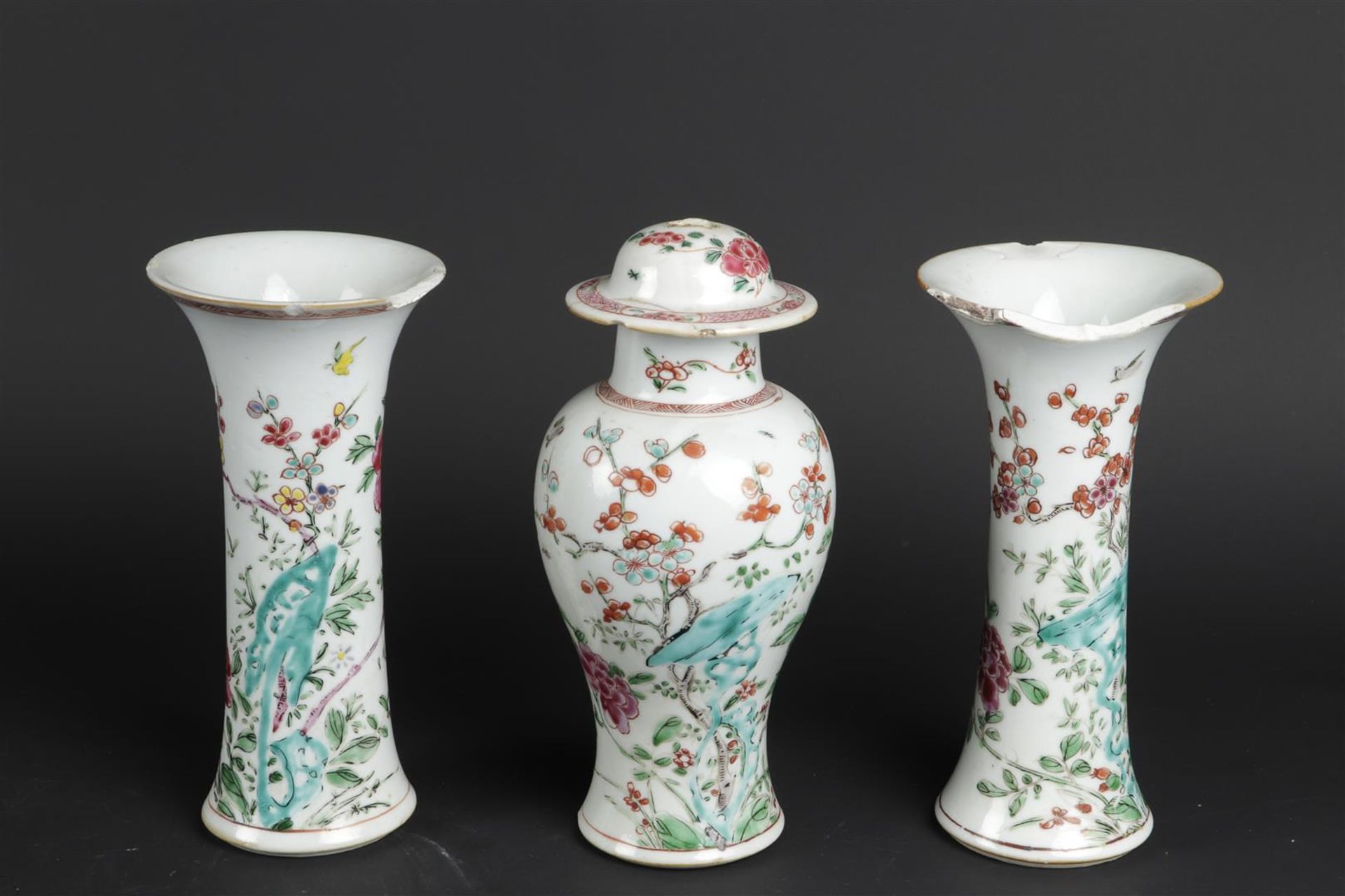 Two porcelain Famille Rose beaker vases and a Famille Rose vase with lid. China, Qianlong.