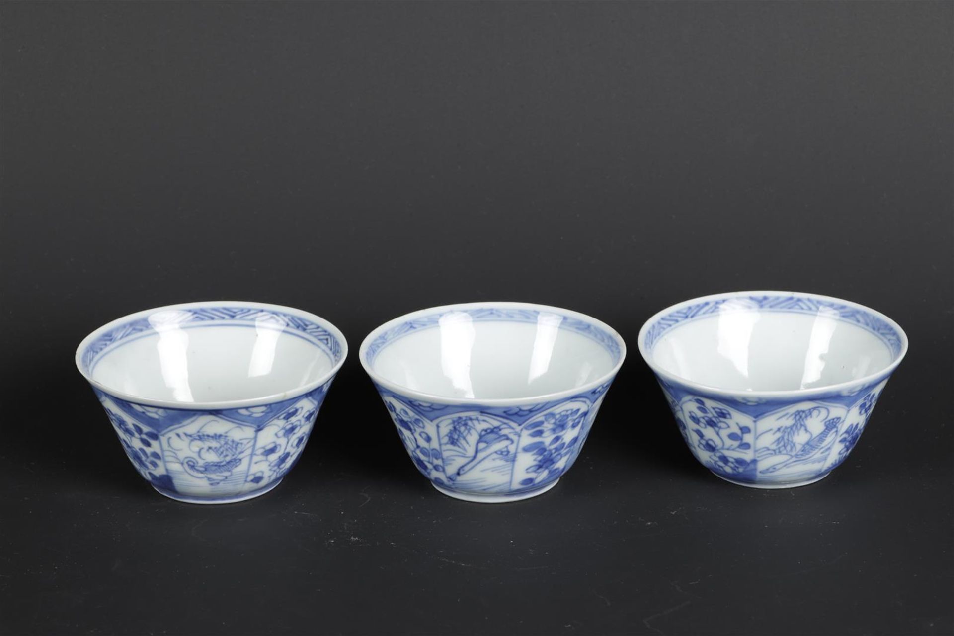 Three porcelain bowls with lotus beds on the outside, with duck and goose decor and with butterfly d