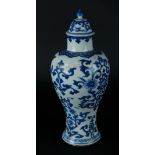 A porcelain lidded vase with a cloud pattern around the neck, and with stylized garlands on the bell