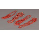 Four red coral necklaces.