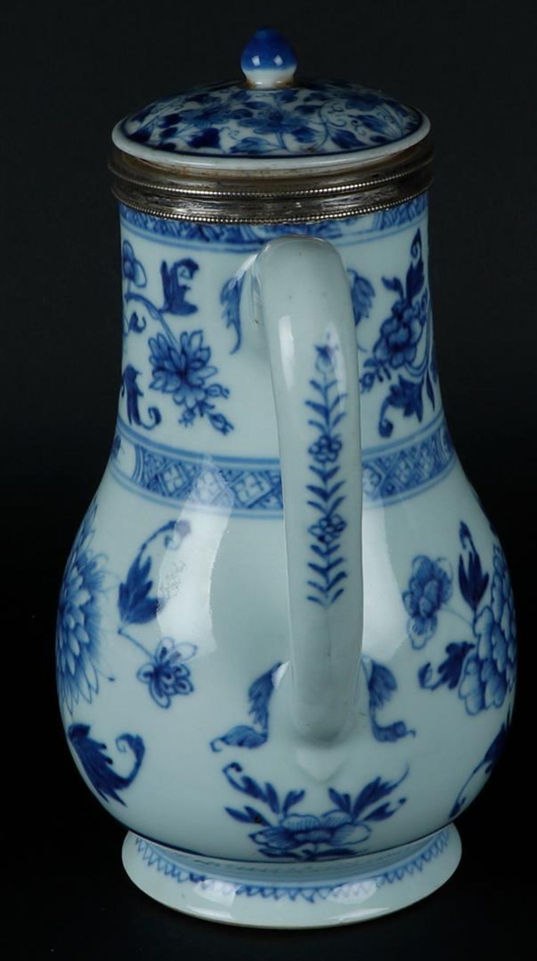 A large porcelain jug with peony decoration, around which rich floral decoration. With silver neck r - Image 4 of 6