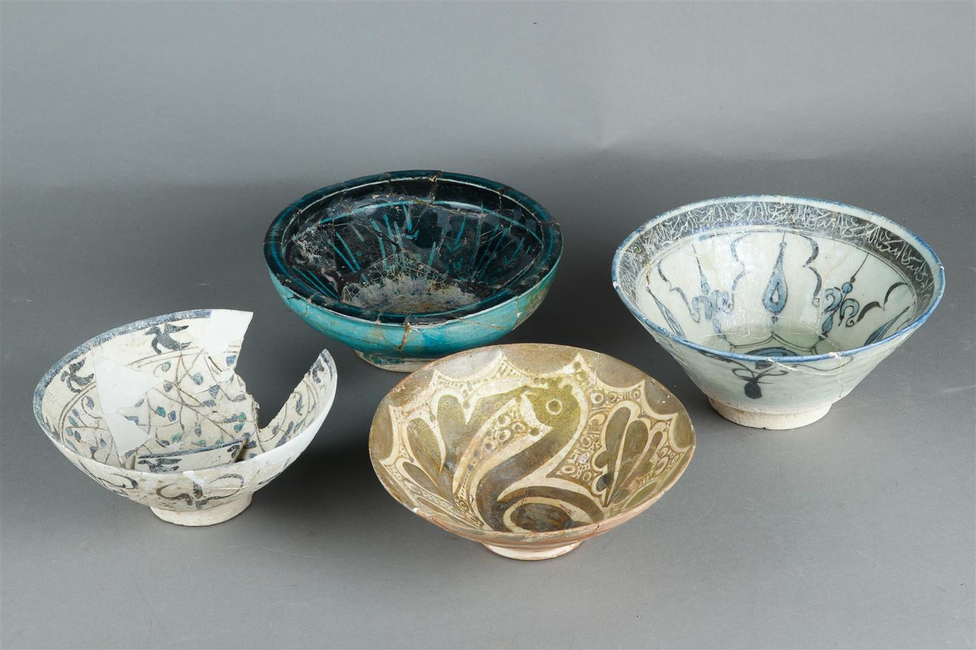 Four various Islamic pottery bowls, Safavid and Raqqa, 14th century and later.