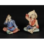 A lot of two pottery figures. China, late 19th century.