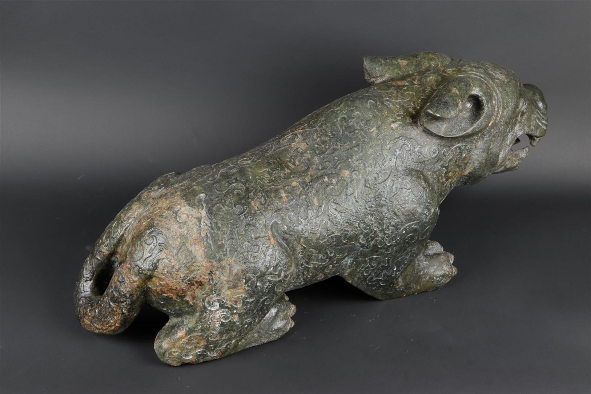 A "Spinach" jade sculpture of a fantasy lion. 20th century. Weight 34.5 kg. - Image 4 of 14