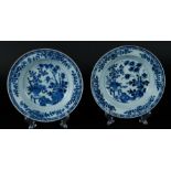 Two porcelain deep plates with floral decor with cachepot decor. China, Qianlong.