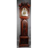 An English grandfather clock with chimes in a richly carved oak case. Approx. 1780.