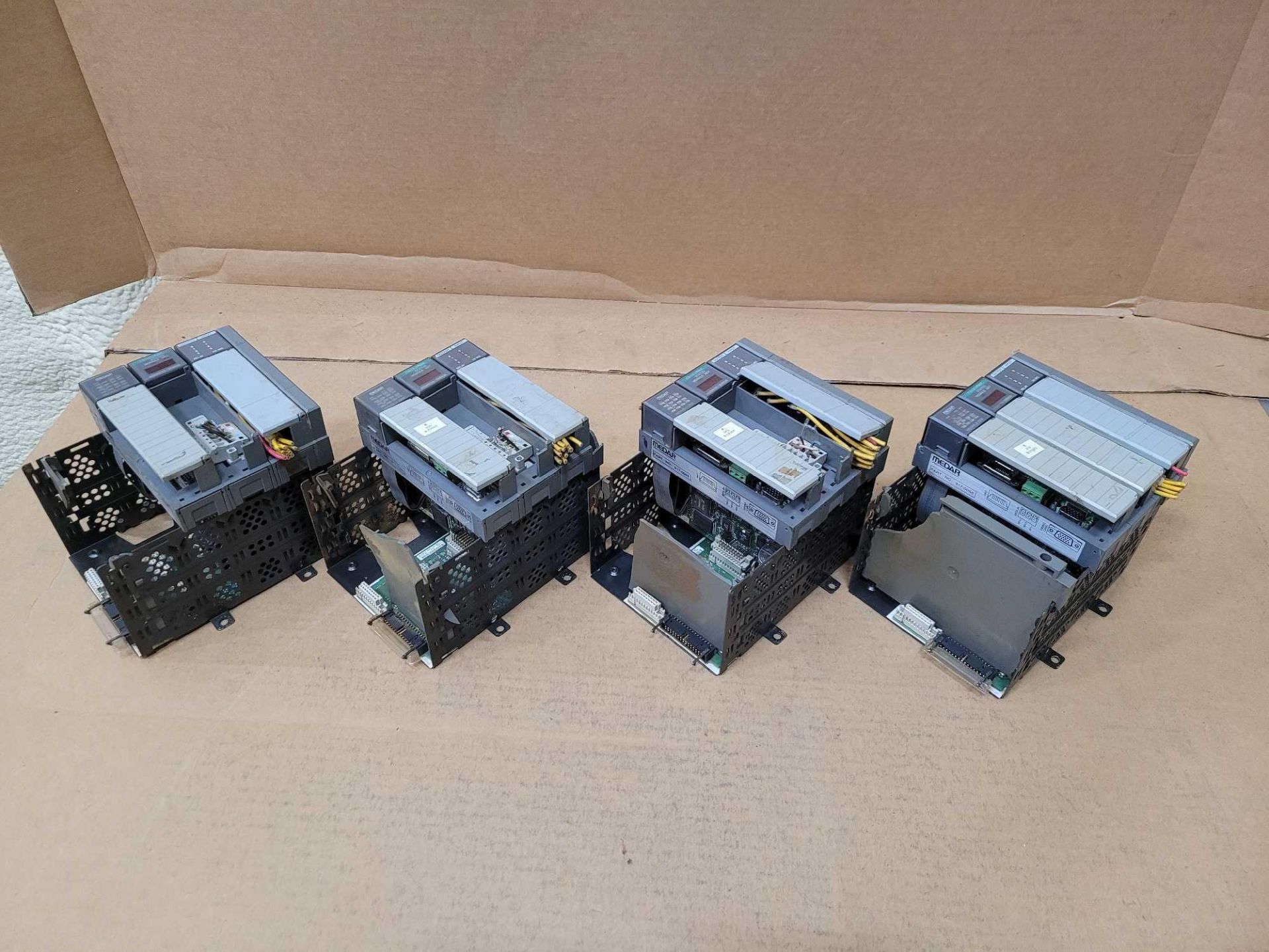 LOT OF 4 ALLEN BRADLEY 1746-A4 4-SLOT CHASSIS W/ [1] MEDAR 917-0050 [1] ALLEN BRADLEY 1747-SDN [1] A