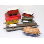 An unboxed Hornby 0 gauge No.2 Lumber Wagon, a 'Castrol' Tanker, a c.1939 'Fyffes' Banana Wagon, a