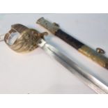 A 19th Century Royal Navy Officer's Sword with shagreen grip within leather and brass scabbard