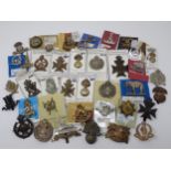 Approximately forty British Amy Badges including Indian Regiments, possibly some re-strikes