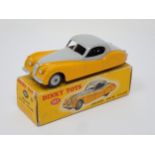 A boxed Dinky Toys No. 157 yellow and grey Jaguar XK120
