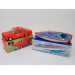 A boxed Schylling Tin Speedboat and a boxed Plasticart Limousine Fire Chief Car