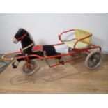 A child's Tricycle in the form of a pony and cart