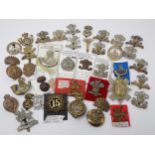 Approximately forty British Army Cap Badges including Scottish and Welsh Regiments, possibly some