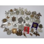 Approximately forty Britsh Amy Cap Badges including Scottish Regiment, possibly some re-strikes