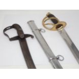 An antique, possibly 18th Century Cavalry type Sabre with wooden grip and a 20th Century Dress Sword