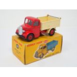 A rare Dinky Toys No.410 green and red Bedford Tipper Lorry with plastic hubs