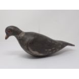 A carved and painted Pigeon Decoy with glass eyes, 13" Long