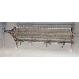 A New South Wales railway brass Luggage Rack with pierced scrolled ends and mesh panels, 2ft 4in W