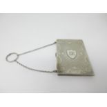 A Victorian silver Card Case with floral engraving and shield cartouche, engraved initials, carrying