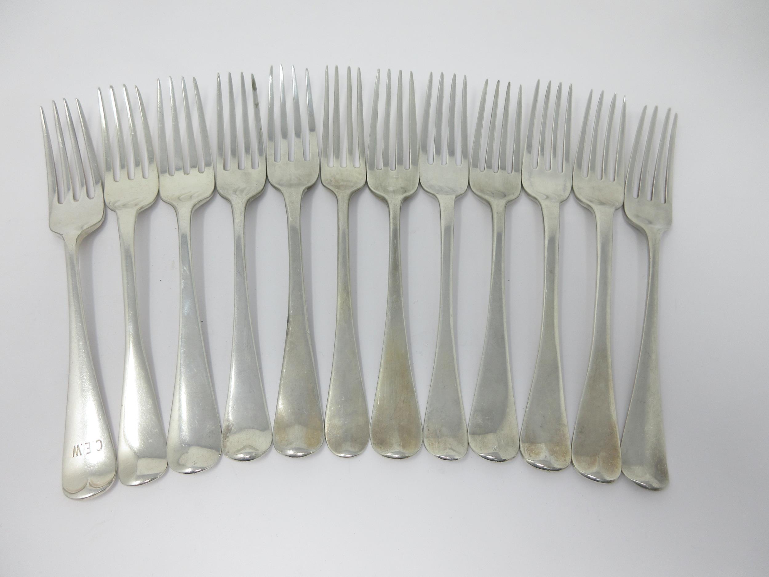 Eleven Georgian and later silver Dinner Forks, various dates and makers, 750gms and a plated Fork - Image 2 of 2