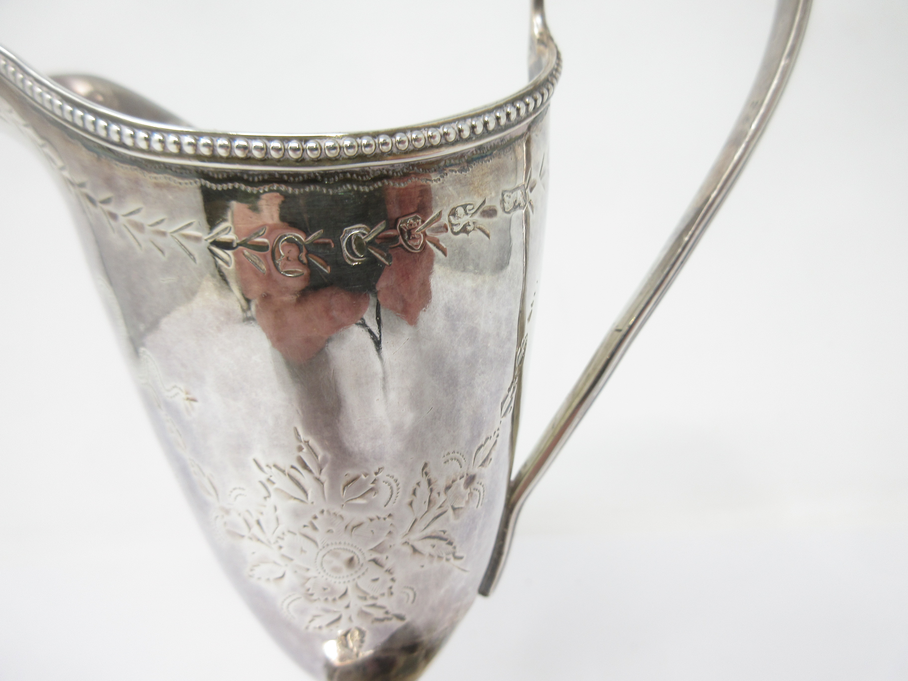 A George III silver helmet shape Cream Jug engraved floral swags, initials in cartouche, beaded - Image 2 of 2