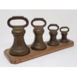 A set of four brass graduated Bell Weights inscribed Borough of Croydon, 1892, 7, 4, 2 and 1lb, 6½