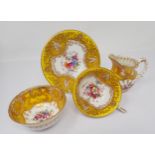 A Royal Worcester Cup and Saucer, Bowl and baluster Cream Jug with floral painted panels signed E.