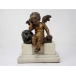 A 19th Century Memento mori bronze Sculpture of Putti resting elbow on skull mounted on stepped