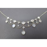 An early 20th Century Moonstone fringe Necklace spectacle-set oval cabochons on fine white metal